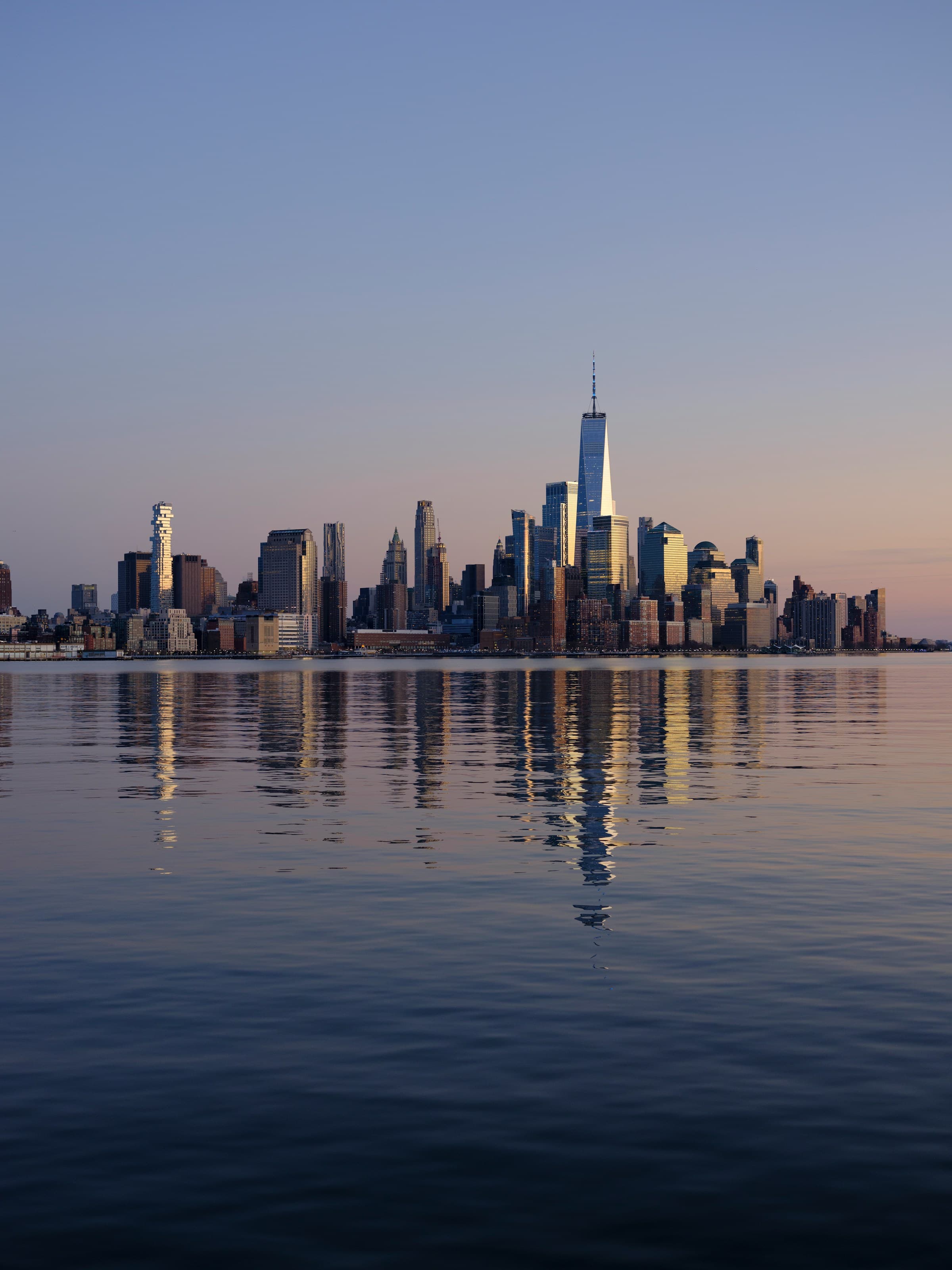 The New Jersey waterfront and the tri-state skyline at dusk